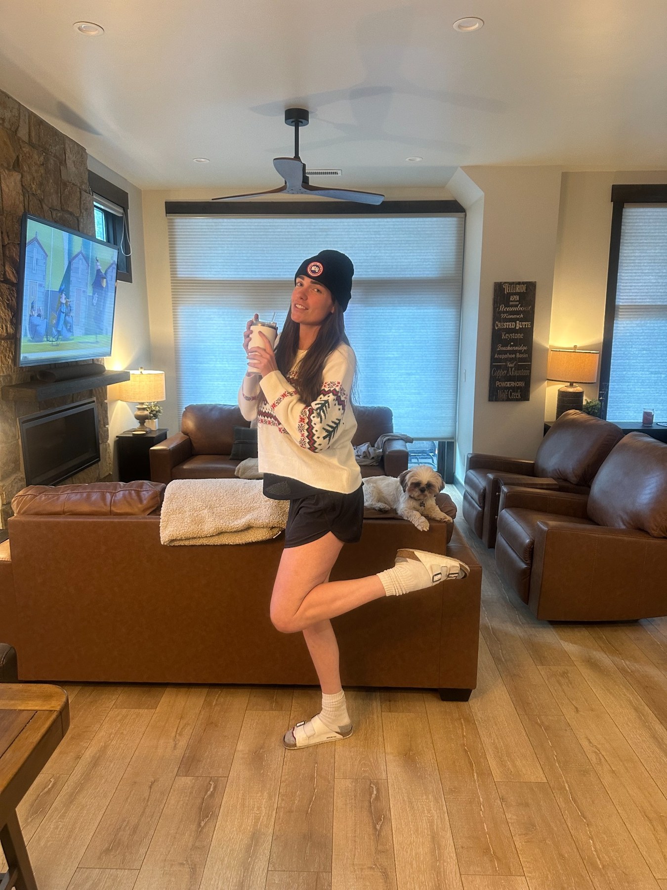 Morgan posing playfully in a winter outfit