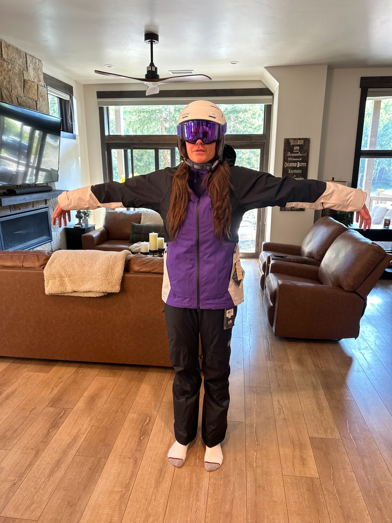 Morgan trying on snow gear indoors